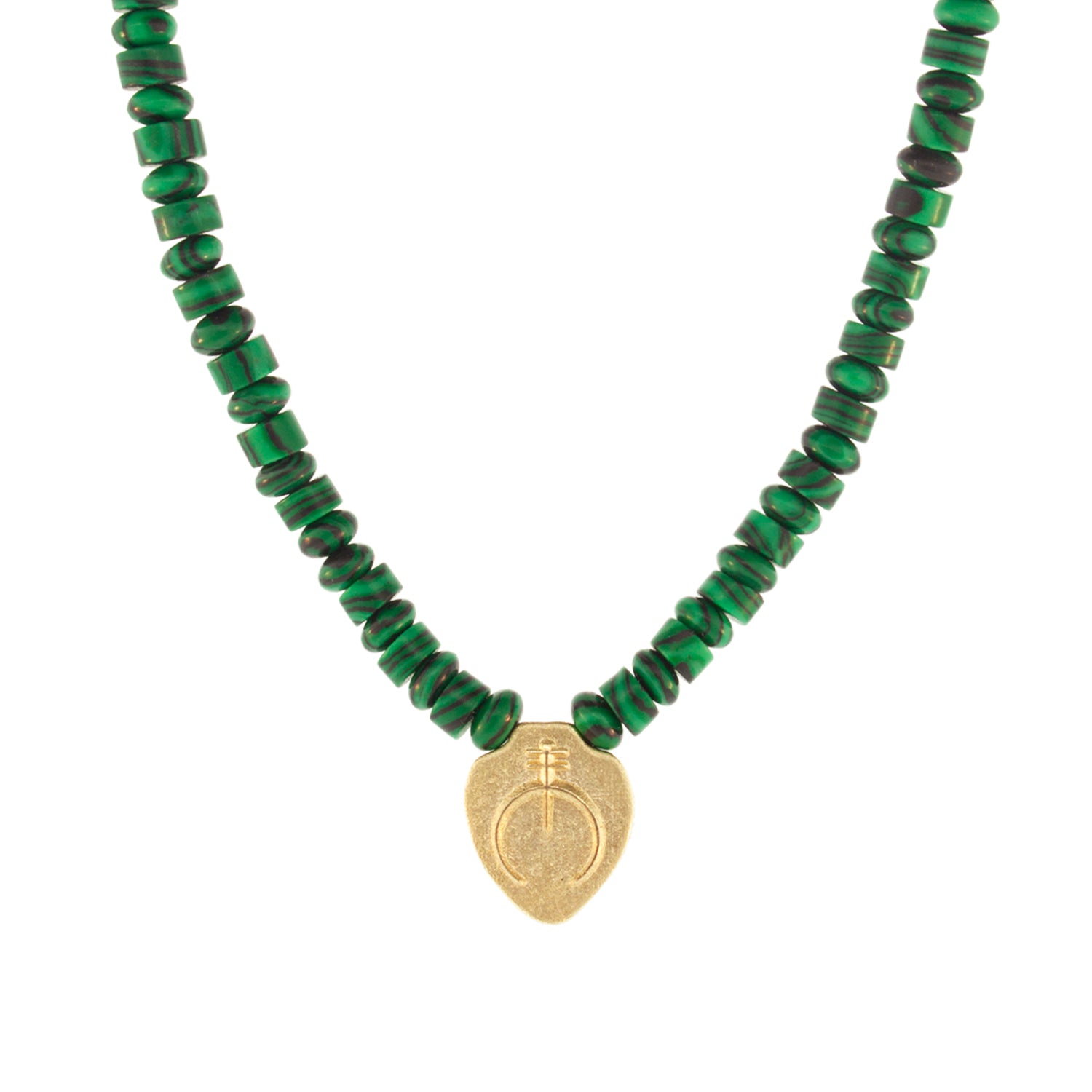 Luis Morais 14K yellow gold shield pendant with a Naja symbol on a malachite gemstone beaded necklace. 14K yellow gold long clasp closure. The length of this necklace is 18 inches, if you would like a different length, please reach out to customer service.