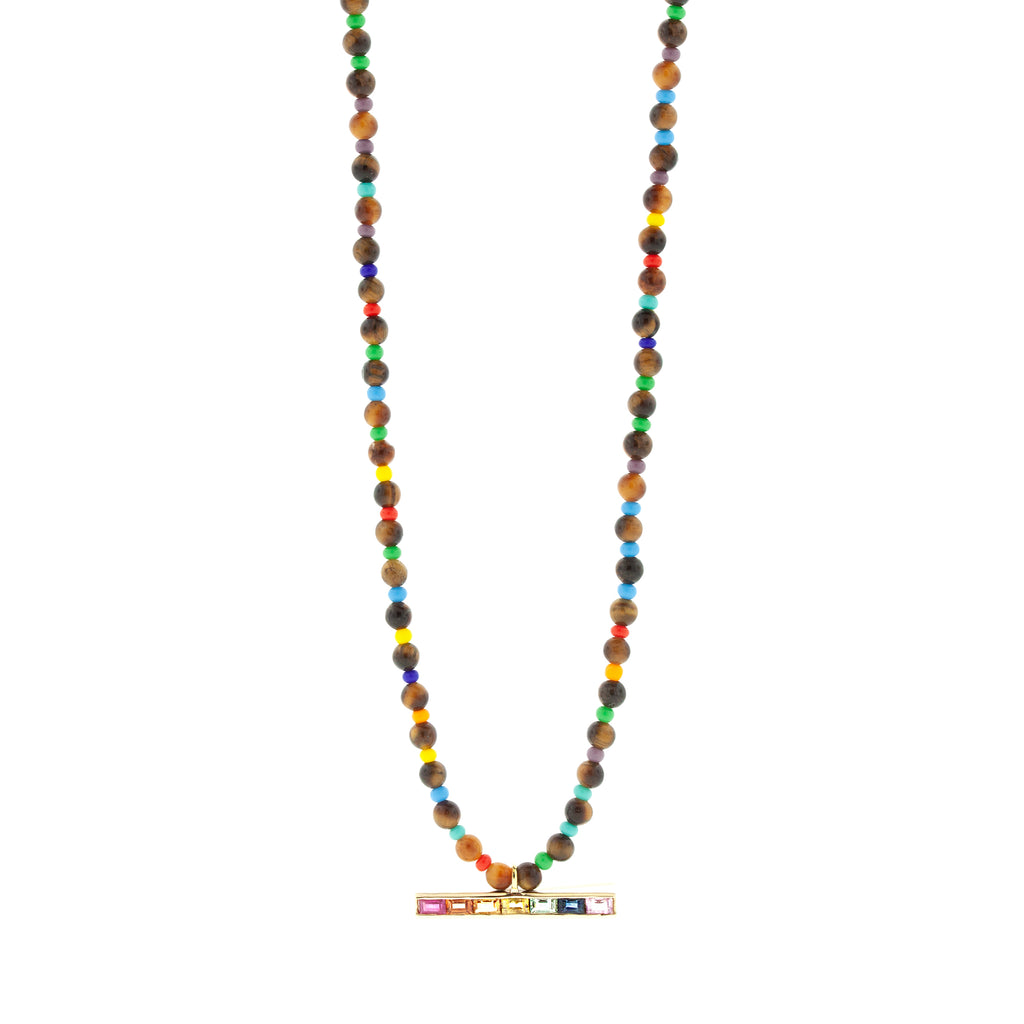 LUIS MORAIS 14k yellow gold medium link ID bar with rainbow sapphire baguettes on a Tiger's Eye and glass beaded necklace. Lobster clasp closure.