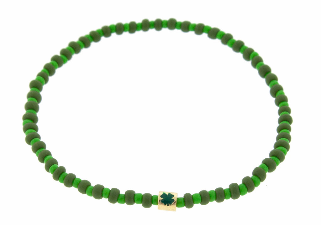 LUIS MORAIS 14K yellow gold short roll with enameled green Four Leaf Clover symbol on a green glass beaded bracelet.