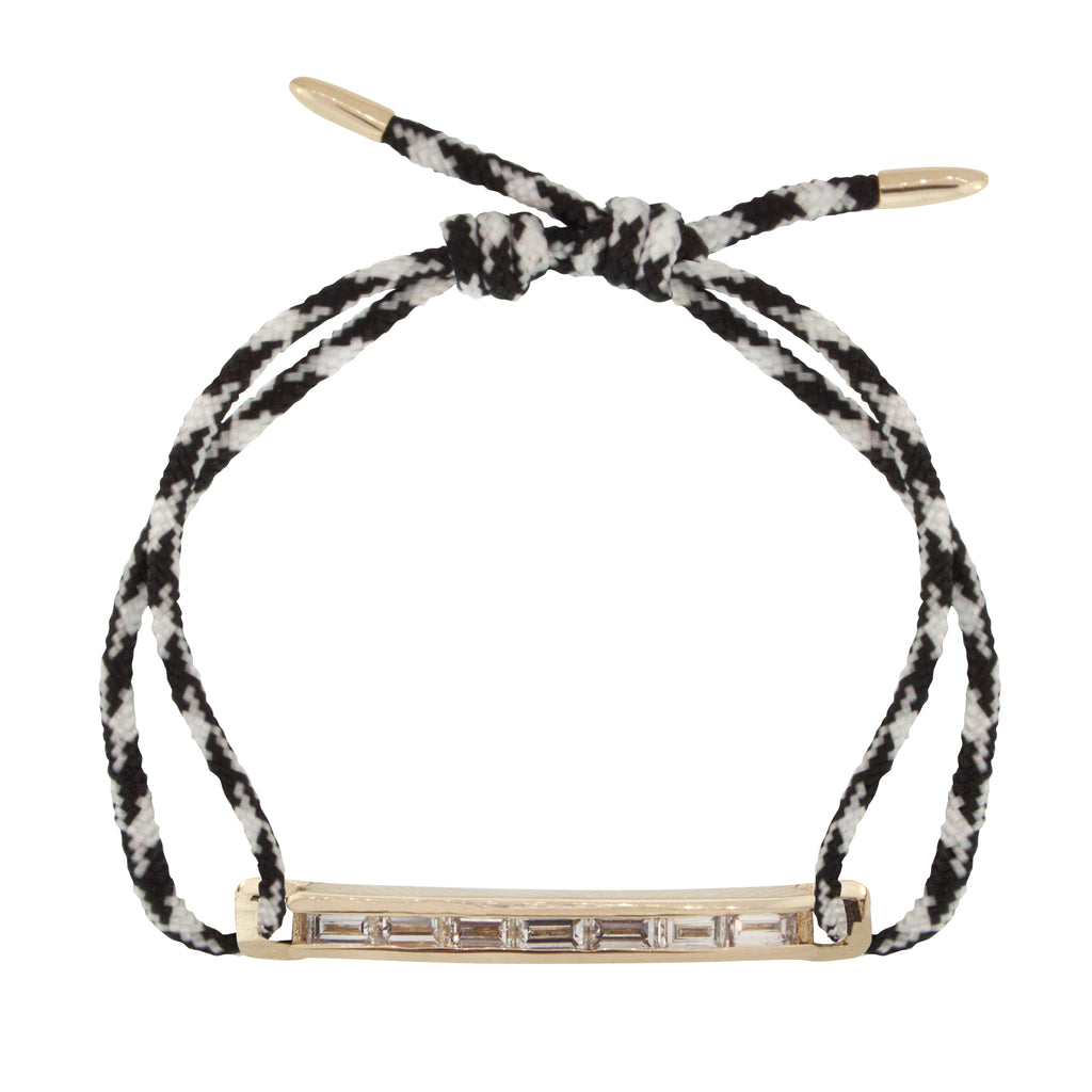 LUIS MORAIS 14K gold medium link bar with white diamond baguettes and bullet tip ends on an adjustable cord bracelet.