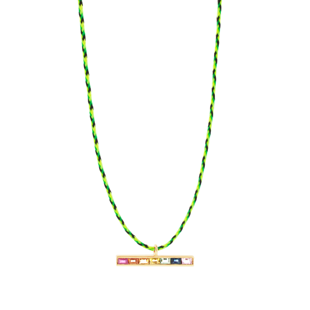 LUIS MORAIS 14k yellow gold medium link ID bar with rainbow Sapphire baguettes on a cord necklace. Lobster clasp closure.   Length: 20 inches