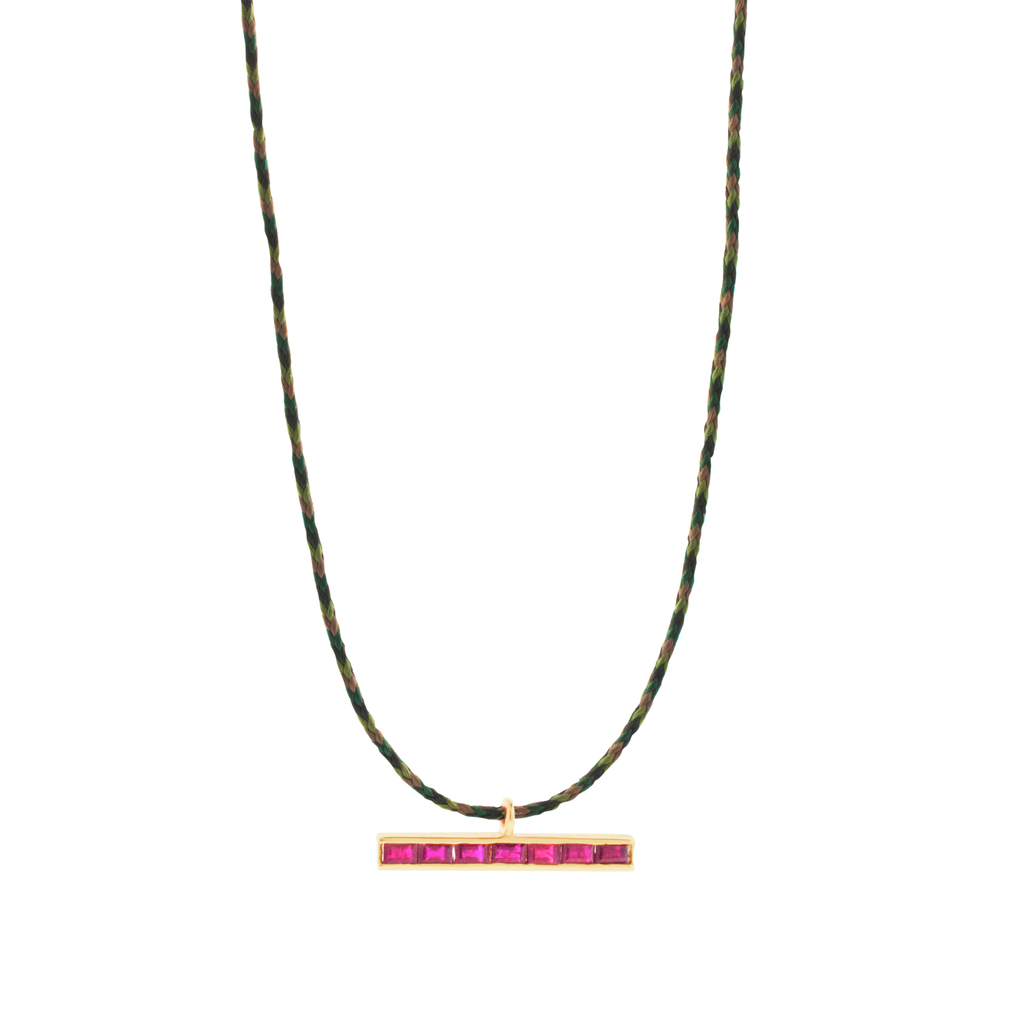 LUIS MORAIS 14k yellow gold medium link ID bar with ruby baguettes on a cord necklace. Lobster clasp closure.   Length: 20 inches