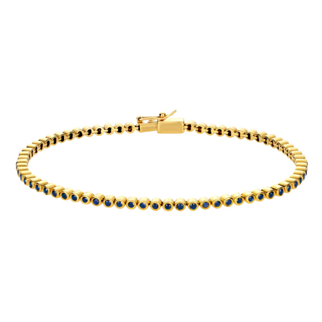 LUIS MORAIS 14K yellow gold tennis bracelet with blue sapphires with hinge closure.     *If you require a size that is not available in the options provided, please indicate your preferred size in the designated text box during checkout.