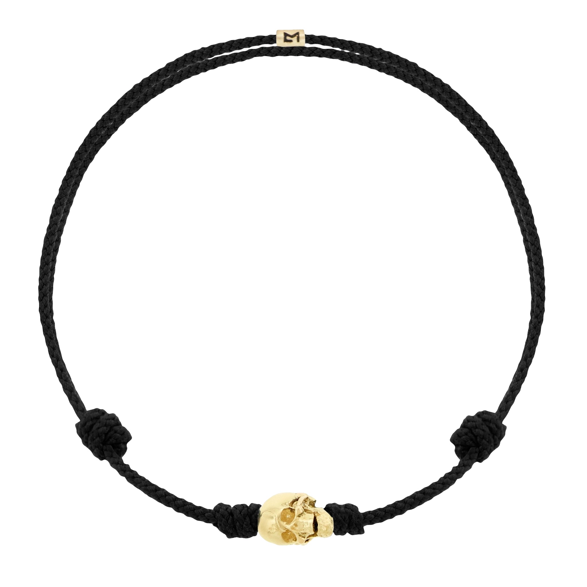 LUIS MORAIS 14k yellow G6 gold skull with moving jaw on an adjustable cord bracelet.