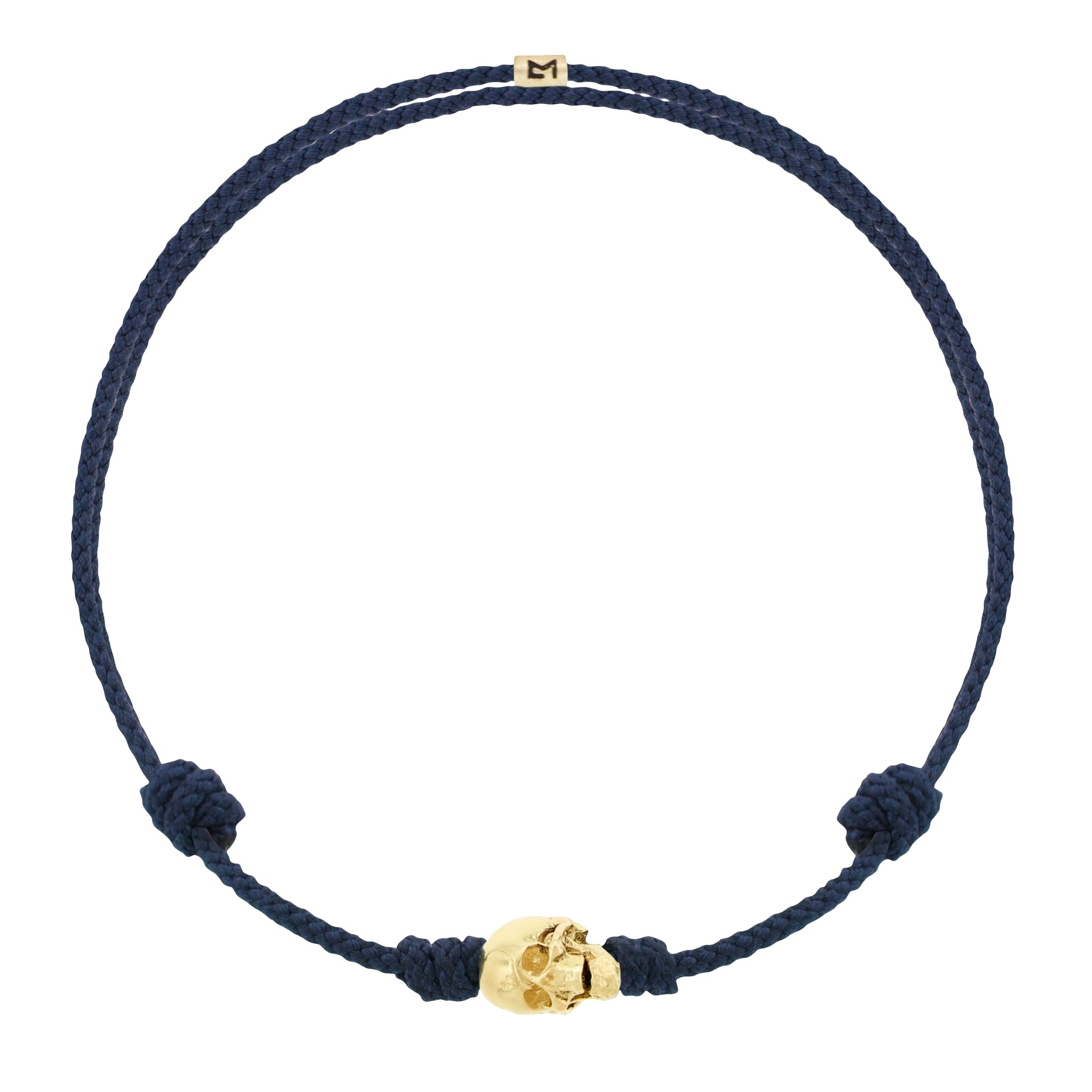 LUIS MORAIS 14k yellow G6 gold skull with moving jaw on an adjustable cord bracelet.