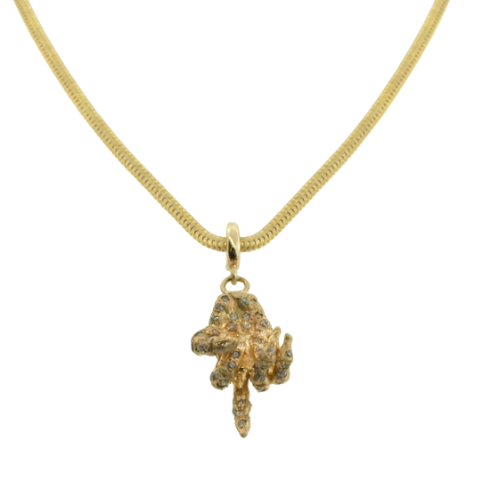 Gold necklace with a textured pendant on a white background