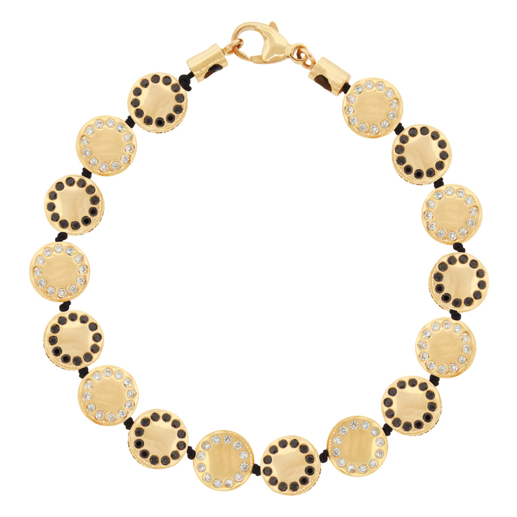 LUIS MORAIS 14k yellow gold bracelet features reversible small disks with white diamonds on one side and black diamonds on the other, separated by knots. 14k yellow gold lobster clasp closure.