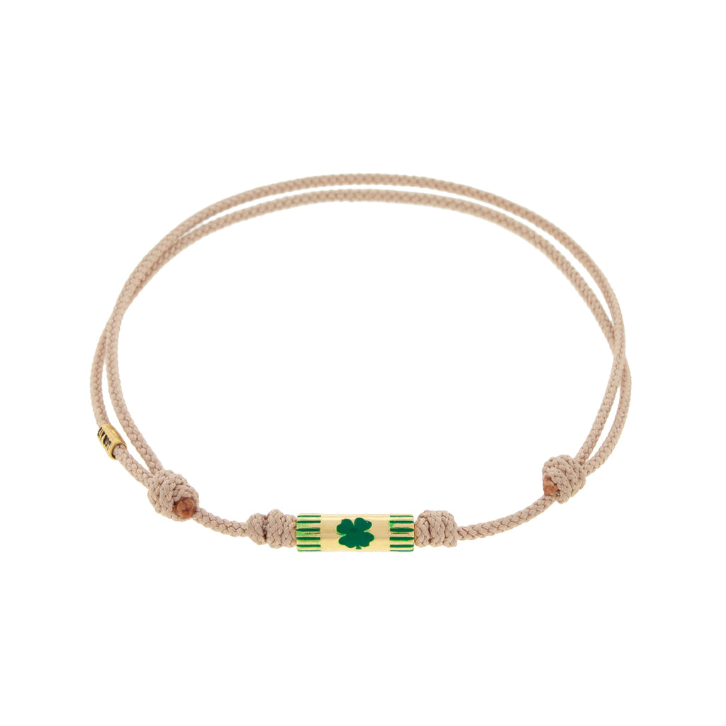 LUIS MORAIS 14K yellow gold slim tube with a green enameled clover on a taupe cord bracelet 