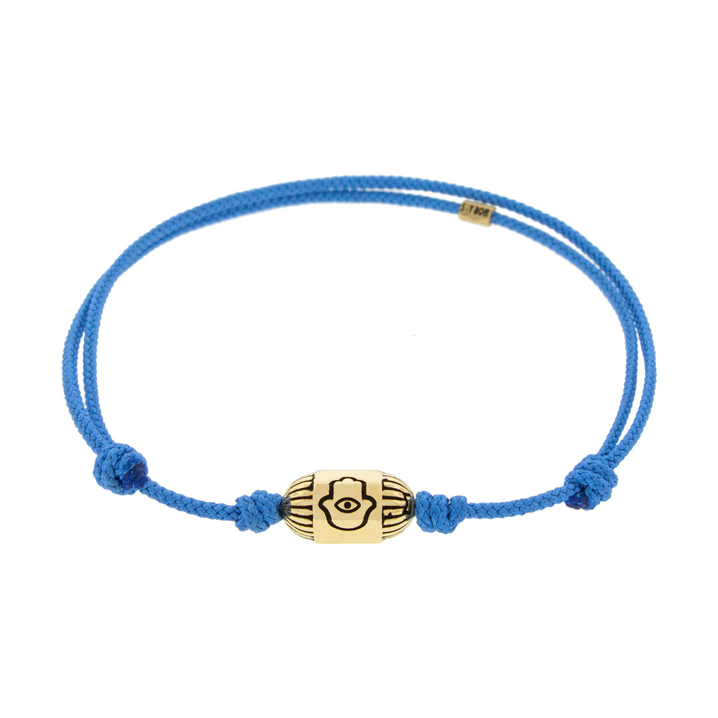 LUIS MORAIS 14K yellow gold ribbed hexagon bolt bead with antiqued hamsa symbol on a light blue cord bracelet