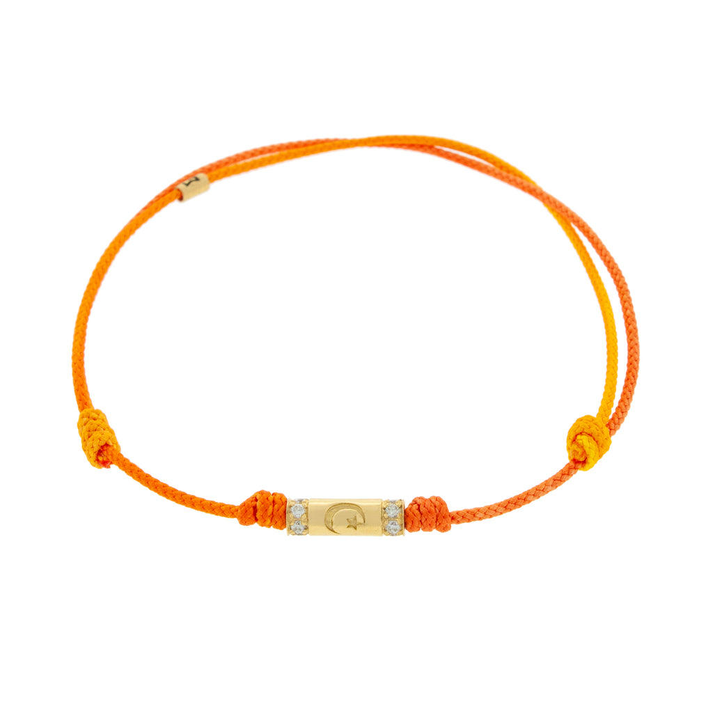 LUIS MORAIS 14K yellow gold slim tube with a moon star symbol and two channels of white diamonds on a orange ombre cord bracelet