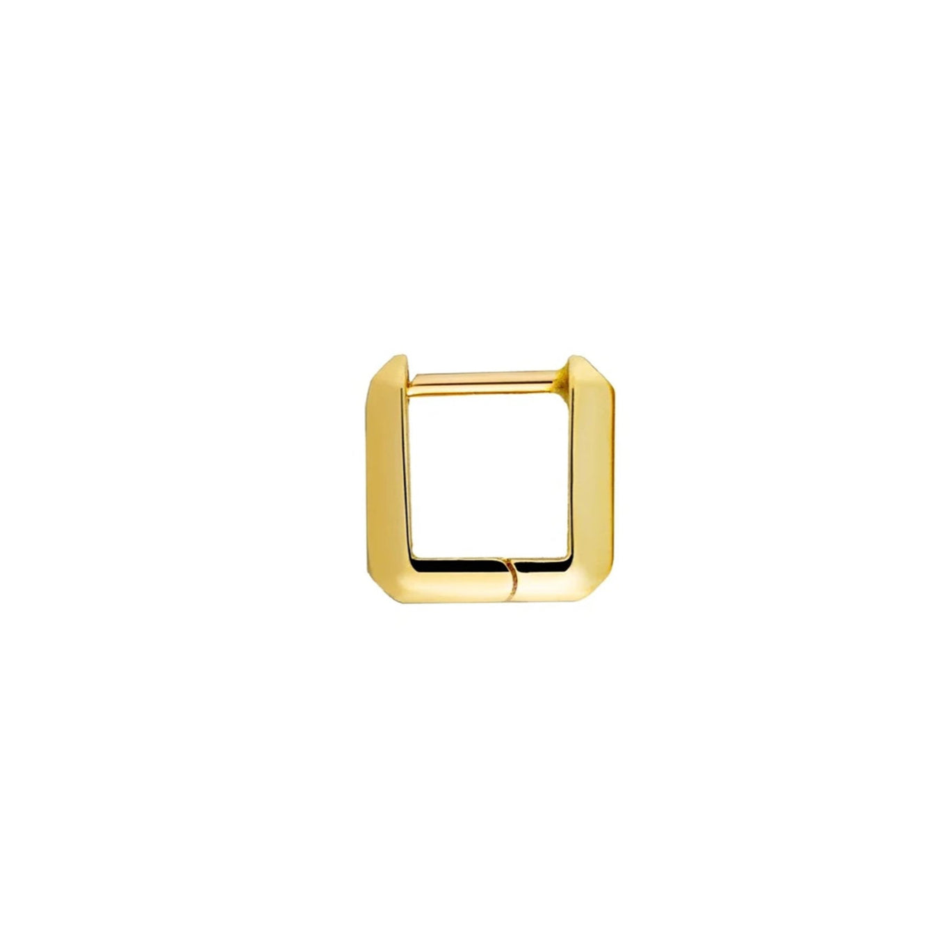 A single small gold link huggie earring against a white background