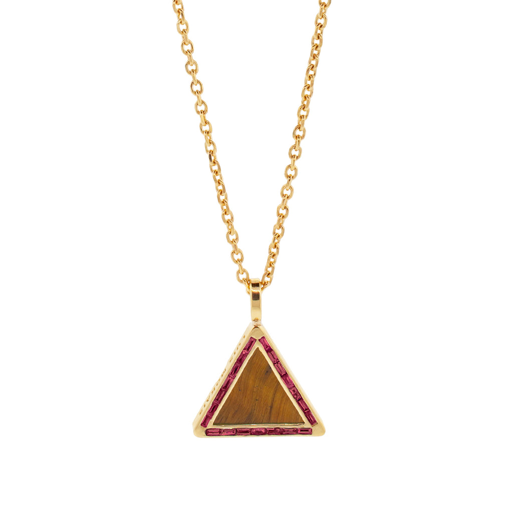 LUIS MORAIS 14K yellow gold triangle pendant with ruby baguettes and a Tiger's Eye gemstone backing.