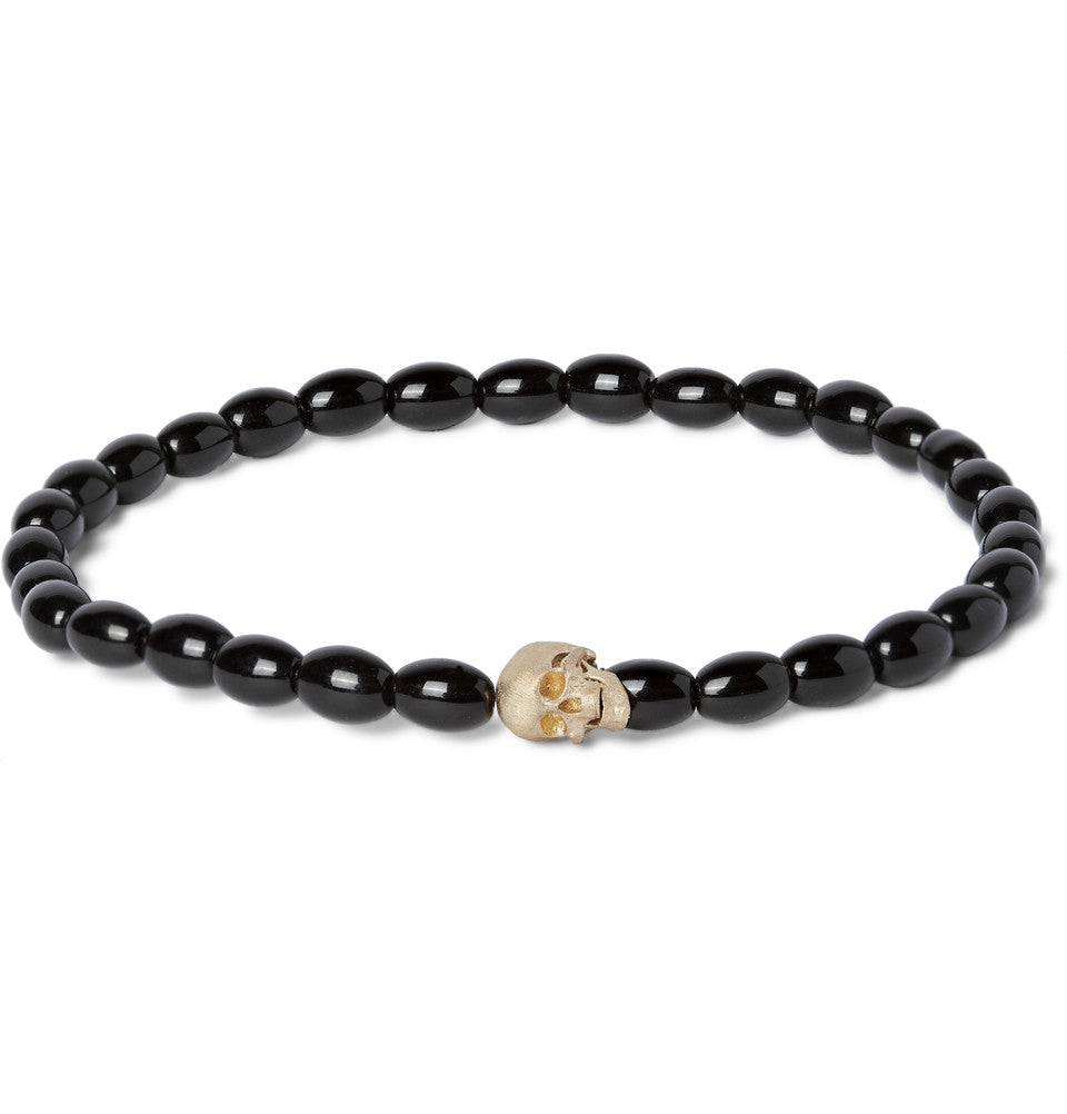 LUIS MORAIS 14k yellow gold G6 skull with moving jaw on a beaded bracelet.