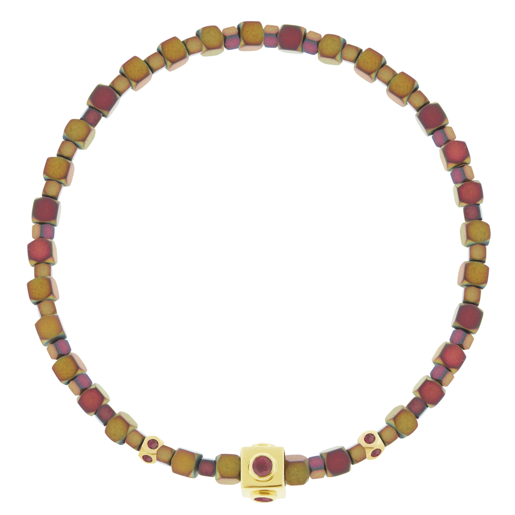 LUIS MORAIS 14k yellow gold Lego cube with four Ruby sides and two mini Tetras with Rubies on a Hematite beaded bracelet.