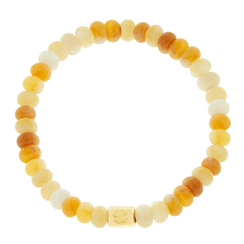 <p>LUIS MORAIS 14k yellow gold ingot with a recessed four-leaf clover symbol on a gemstone beaded bracelet.</p> <ul> <li></li> </ul>