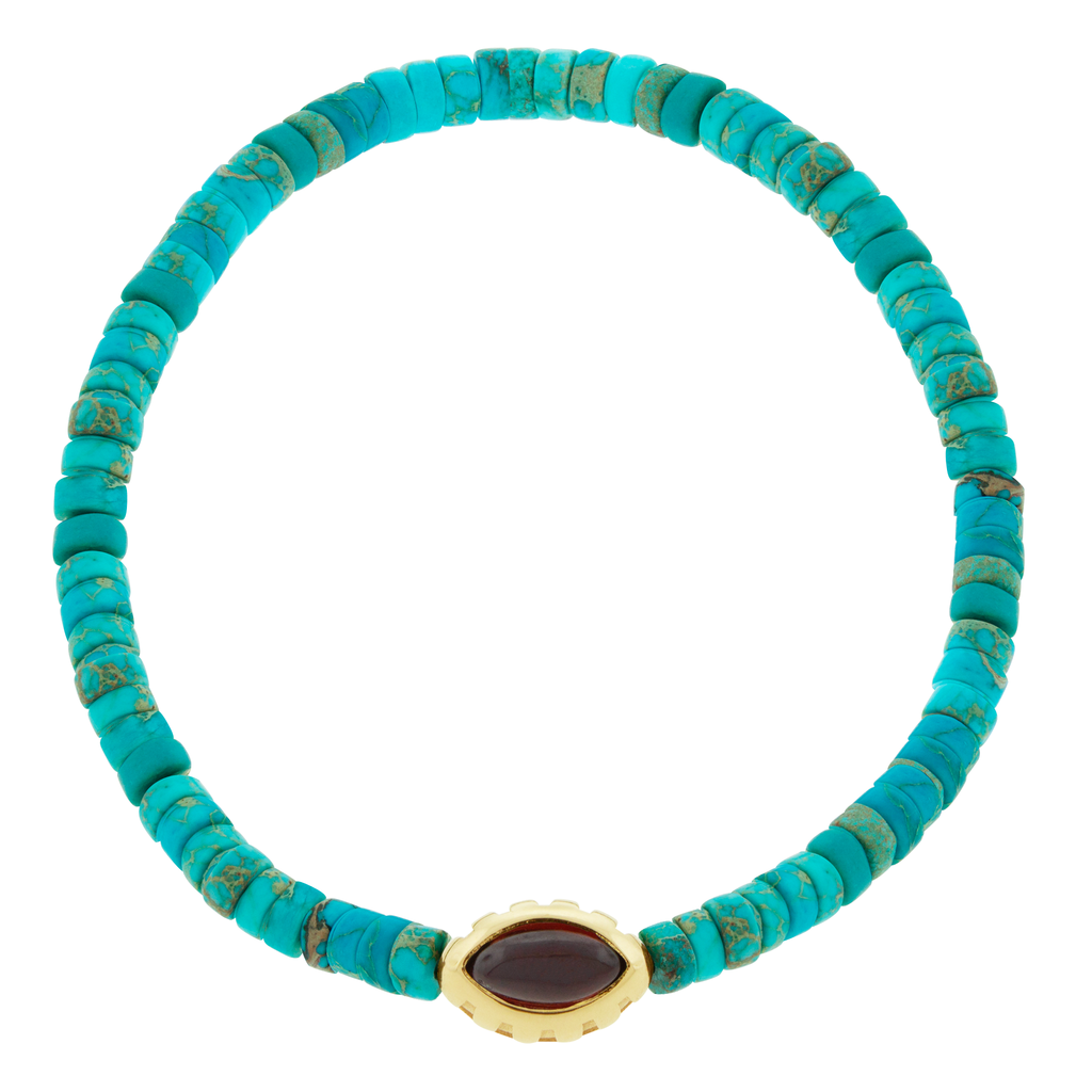 LUIS MORAIS 14k yellow gold Eye of the Idol bead with a marquise Garnet gemstone on a Turquoise beaded bracelet.