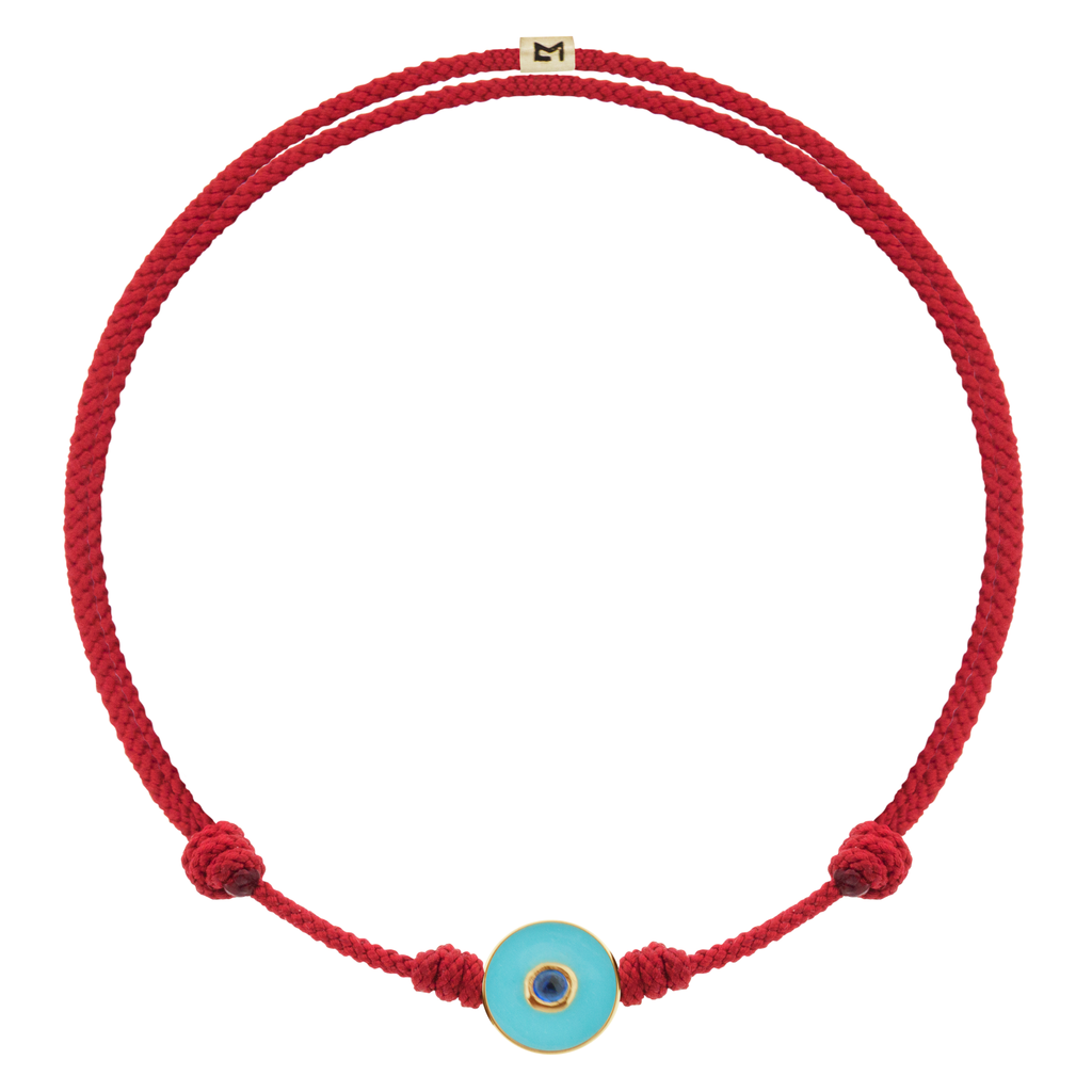 LUIS MORAIS 14k yellow gold small enameled Evil Eye disk with a blue Sapphire gemstone in the center on an adjustable cord bracelet. Features a 14k yellow gold logo spacer.     If you require a size that is not available in the options provided, please indicate your preferred size in the designated text box during checkout.