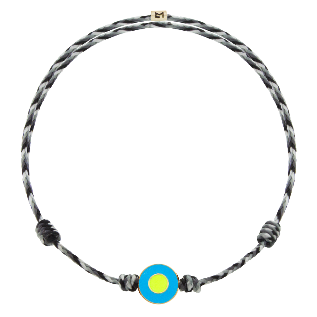 LUIS MORAIS 14k yellow gold small disk with a recessed double-enameled evil eye on an adjustable cord bracelet. Features a 14k yellow gold logo spacer.  *If you require a size that is not available in the options provided, please indicate your preferred size in the designated text box during checkout.