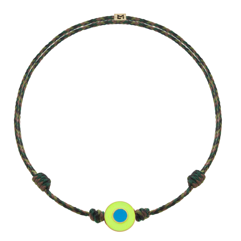 LUIS MORAIS 14k yellow gold small disk with a recessed double-enameled evil eye on an adjustable cord bracelet. Features a 14k yellow gold logo spacer.  *If you require a size that is not available in the options provided, please indicate your preferred size in the designated text box during checkout.