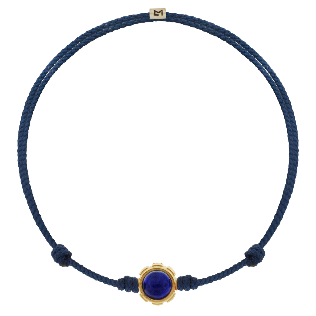 LUIS MORAIS 14k yellow gold rotary collar with Lapis and Tiger's Eye cabochon gemstones on an adjustable cord bracelet. Features a 14k yellow gold logo spacer.  *If you require a size that is not available in the options provided, please indicate your preferred size in the designated text box during checkout.