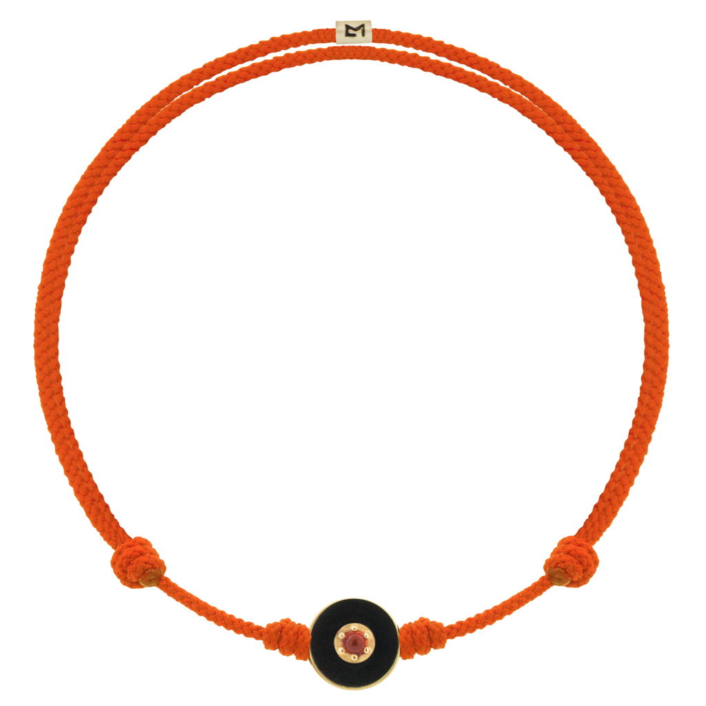 LUIS MORAIS 14k yellow gold small enameled Evil Eye disk with a Coral gemstone in the center on an adjustable cord bracelet. Features a 14k yellow gold logo spacer.     If you require a size that is not available in the options provided, please indicate your preferred size in the designated text box during checkout.