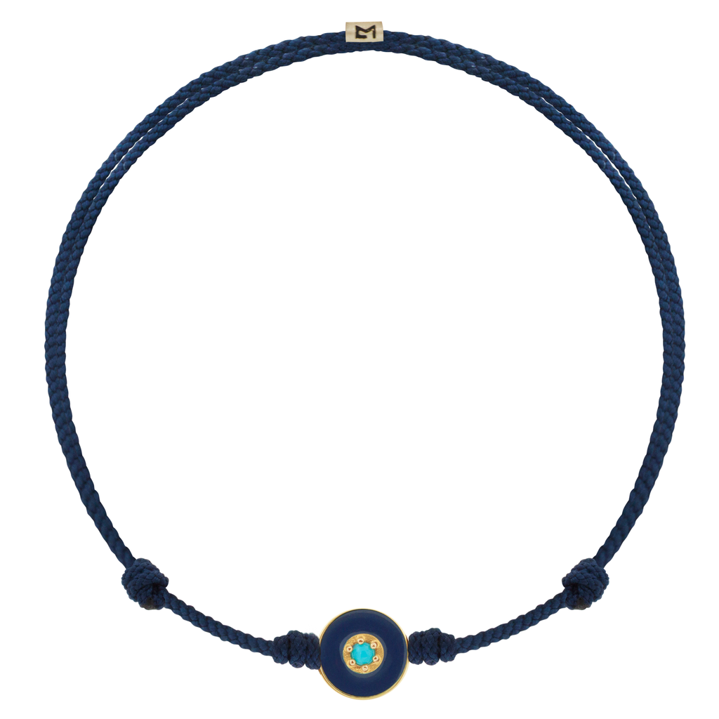 LUIS MORAIS 14k yellow gold small enameled Evil Eye disk with a Turquoise  gemstone in the center on an adjustable cord bracelet. Features a 14k yellow gold logo spacer.     If you require a size that is not available in the options provided, please indicate your preferred size in the designated text box during checkout.