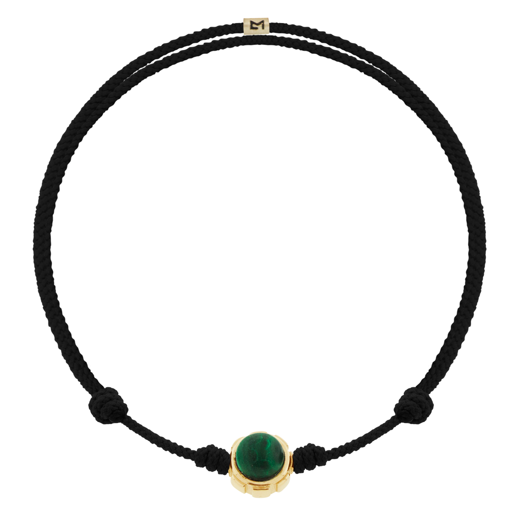 LUIS MORAIS 14k yellow gold rotary collar with Onyx and Malachite cabochon gemstones on an adjustable cord bracelet. Features a 14k yellow gold logo spacer.  *If you require a size that is not available in the options provided, please indicate your preferred size in the designated text box during checkout.