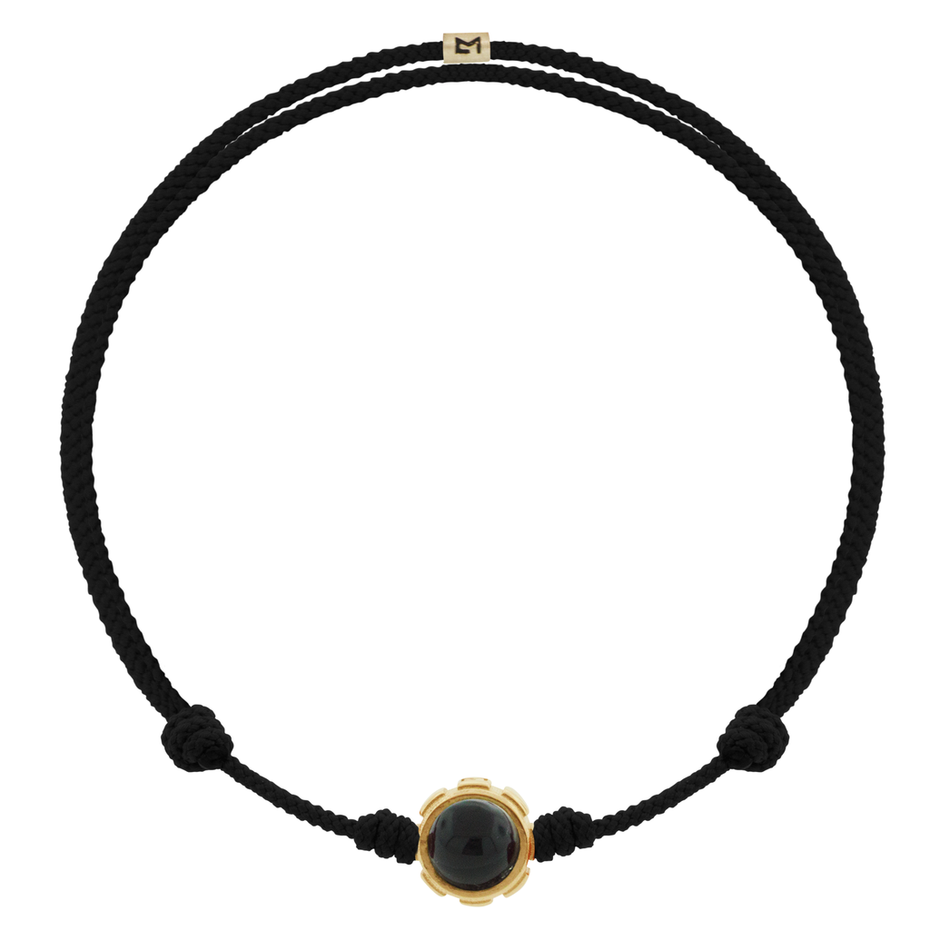 LUIS MORAIS 14k yellow gold rotary collar with Onyx and Malachite cabochon gemstones on an adjustable cord bracelet. Features a 14k yellow gold logo spacer.  *If you require a size that is not available in the options provided, please indicate your preferred size in the designated text box during checkout.