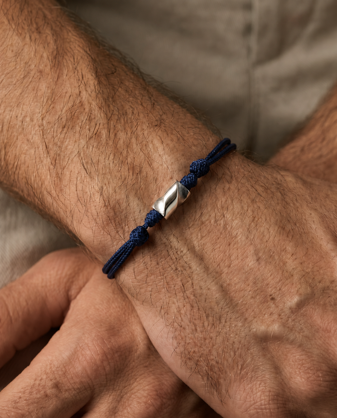 Long White Gold Drill Bit on Navy Cord Bracelet