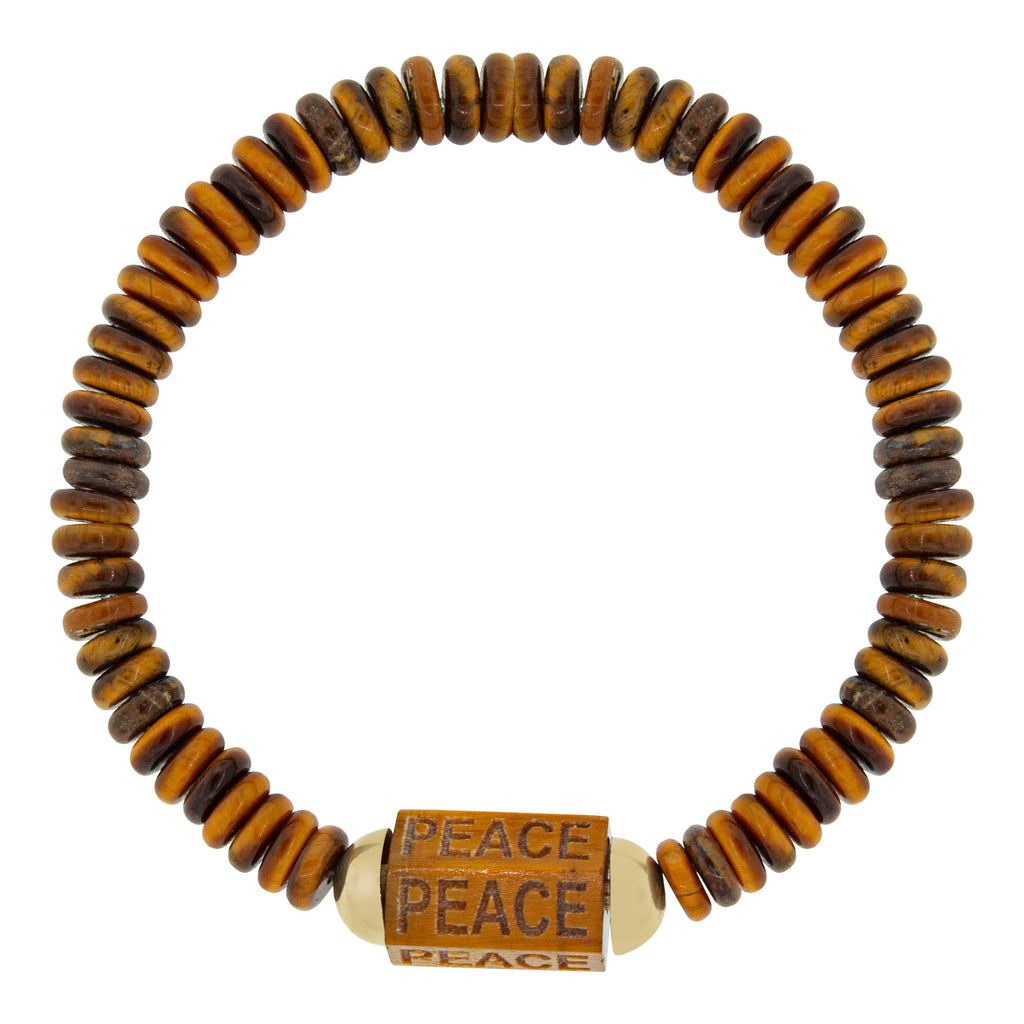 LUIS MORAIS 14K yellow gold extra large hexagon tiger's eye gemstone bolt bead with carved words on a tiger's eye beaded bracelet.