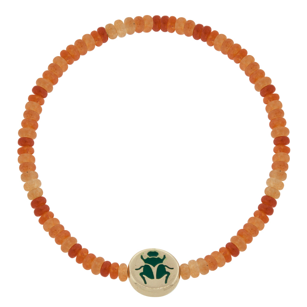 LUIS MORAIS 14K yellow gold large disk with enameled symbol on a carnelian gemstone beaded bracelet.