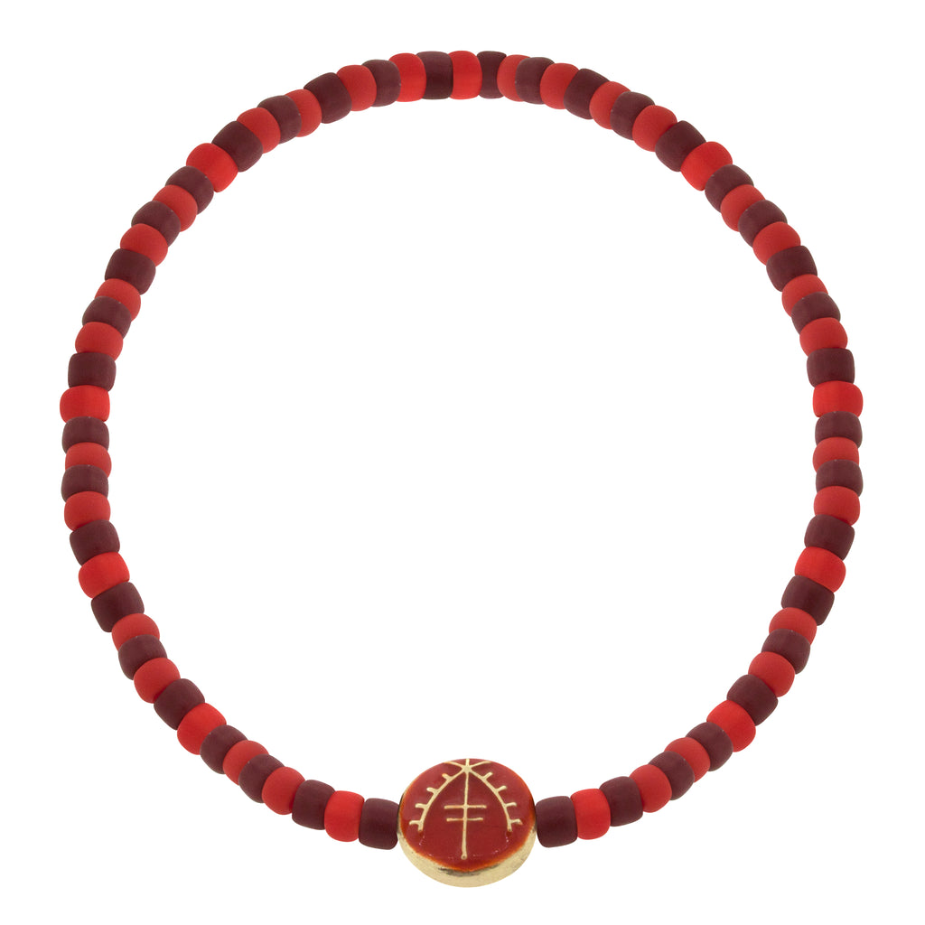 LUIS MORAIS 14K yellow gold small disk with enameled Moor symbol on a glass beaded bracelet. 