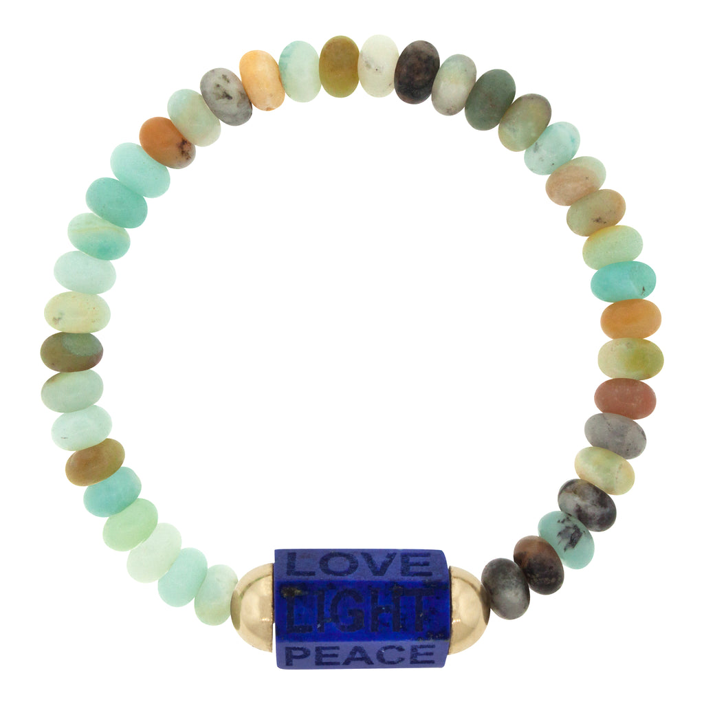 LUIS MORAIS 14K yellow gold extra large hexagon lapis gemstone bolt bead with carved words on an agate beaded bracelet.