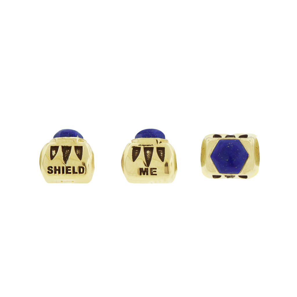 LUIS MORAIS 14k yellow gold ingot with a Lapis hexagon with antiqued words on an adjustable cord bracelet.