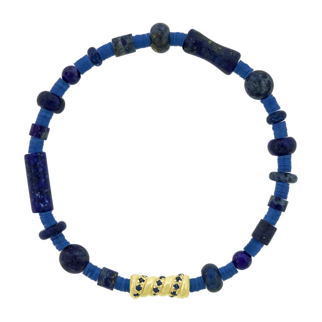 Blue beaded bracelet with a gold accent on a white background
