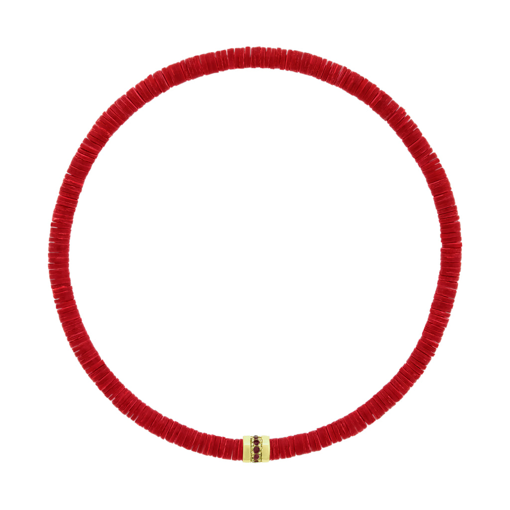 LUIS MORAIS 14K yellow gold short roll with a line of round rubies on a vinyl beaded bracelet. A versatile piece that pairs easily with other styles and is ideal for adding to your stack.