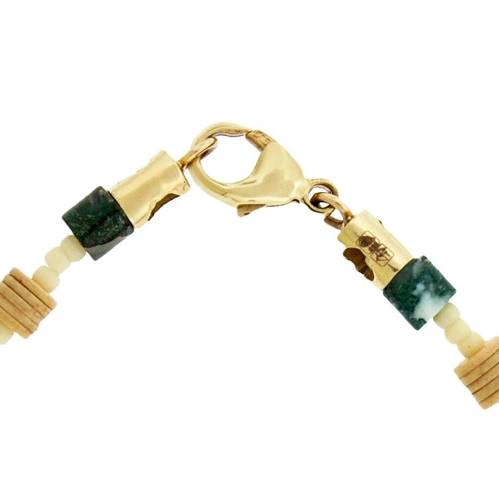 Yellow gold clasp with natural stone beads on a white background