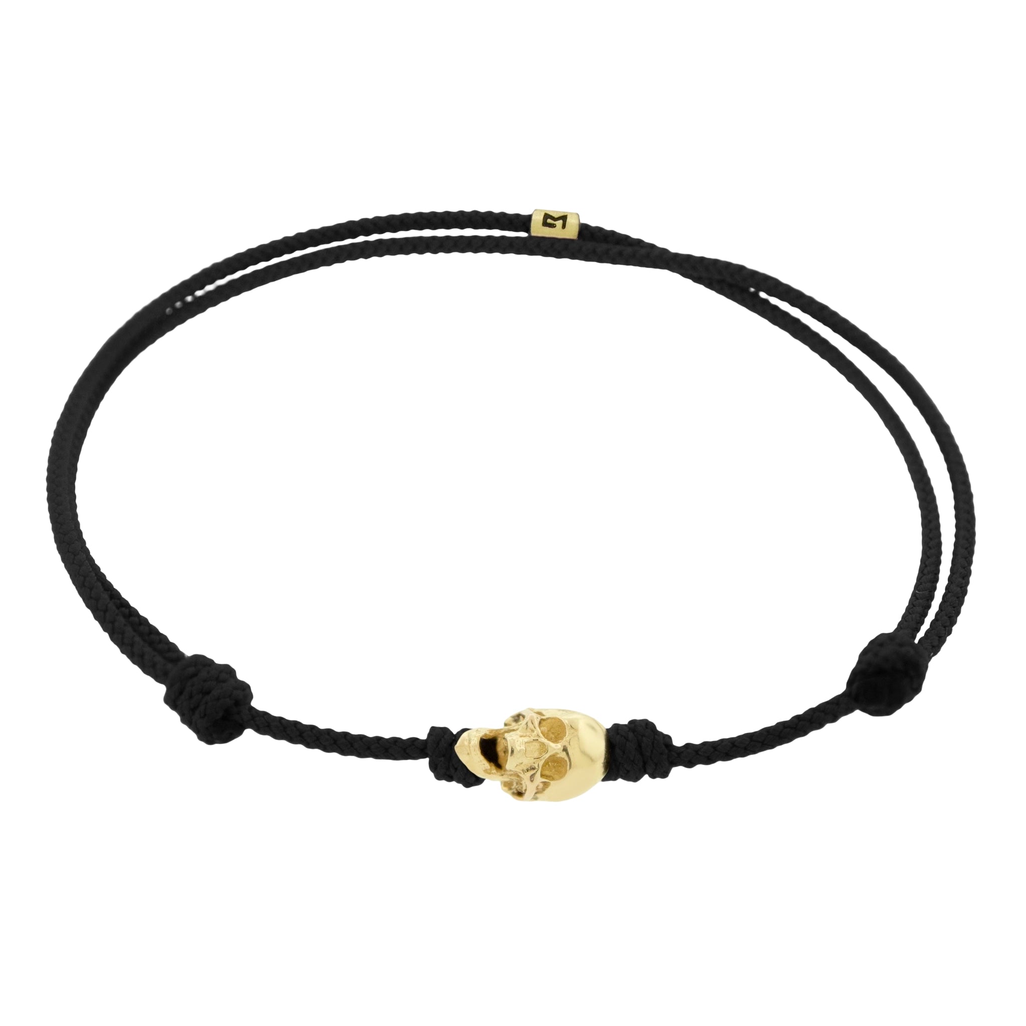 LUIS MORAIS 14k yellow G6 gold skull with moving jaw on an adjustable cord bracelet.
