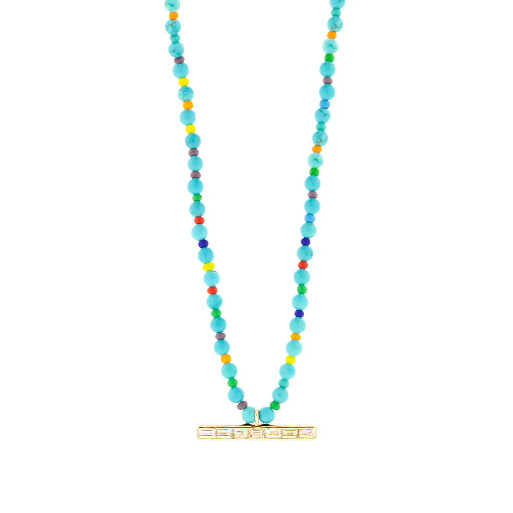 LUIS MORAIS 14k yellow gold medium link ID bar with TLC diamond baguettes on a Turquoise and glass beaded necklace. Lobster clasp closure.