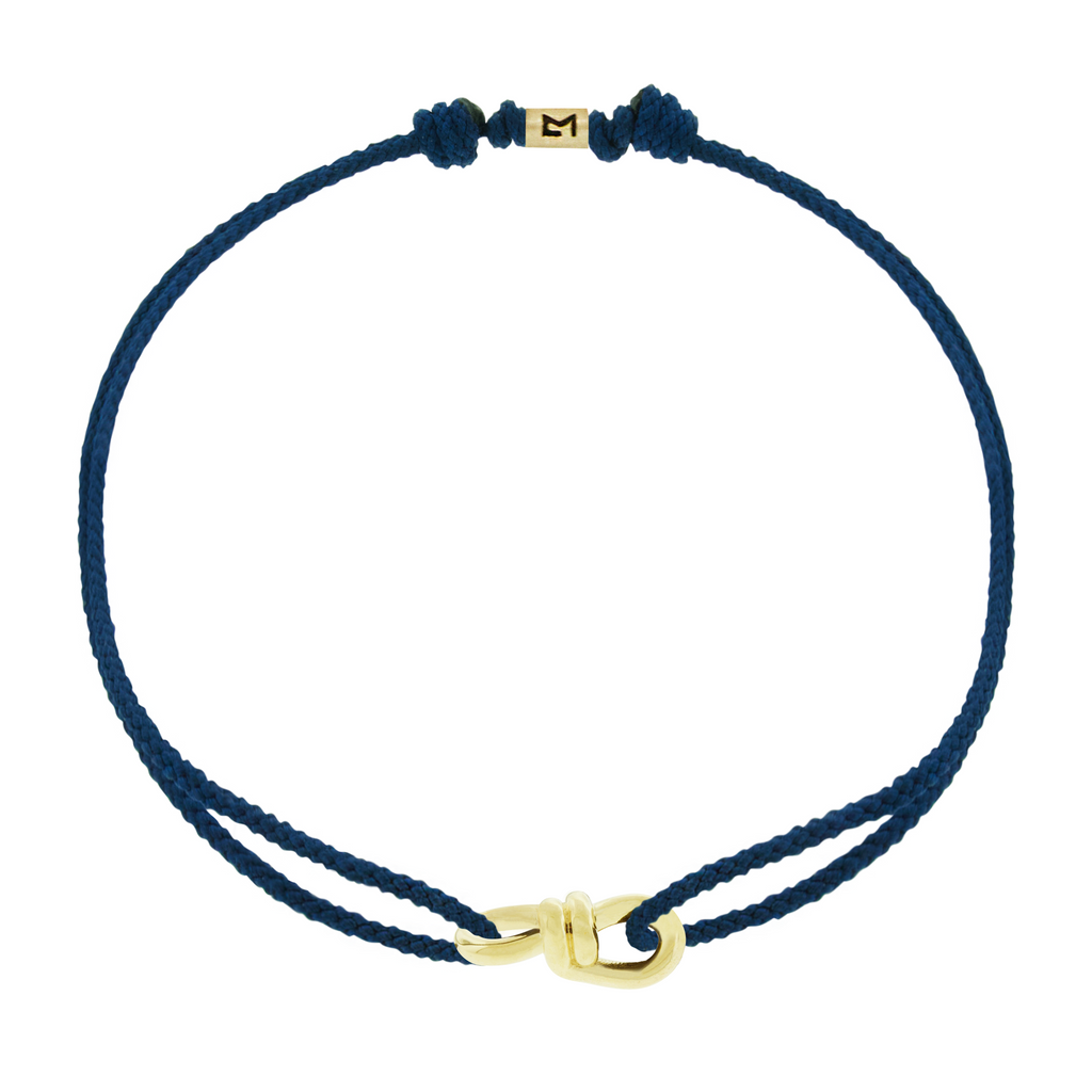 LUIS MORAIS 14k yellow gold large twisted wire knot on a thick cord bracelet.&nbsp;