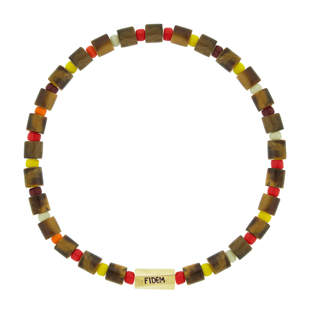 LUIS MORAIS 14k yellow gold large twisted hexagon with navy enameled words on a gemstone and glass beaded bracelet. Engraved with the word "fidem" which means faith in Latin