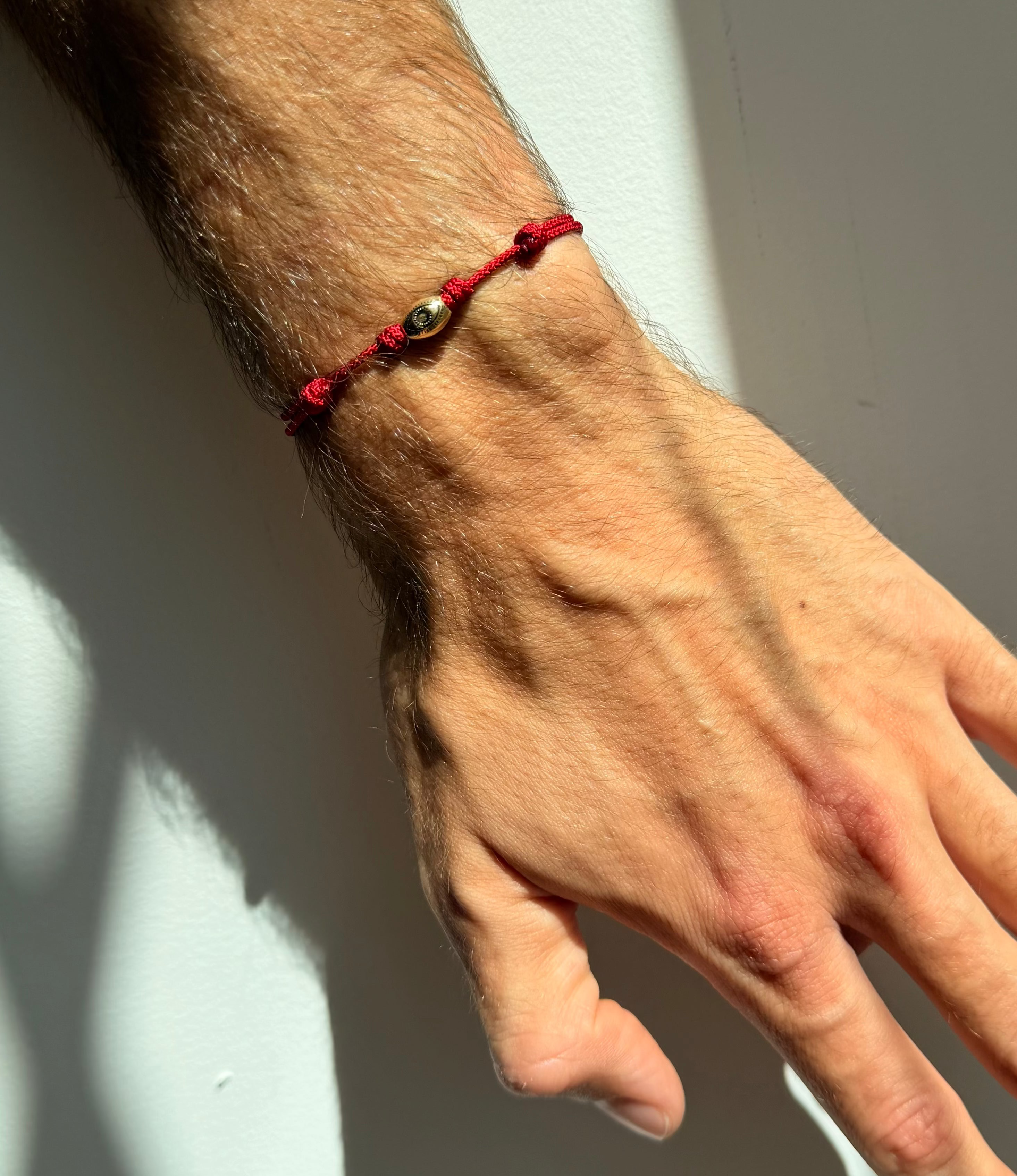 LUIS MORAIS Antiqued Eye Drum Bead on Red Cord Bracelet