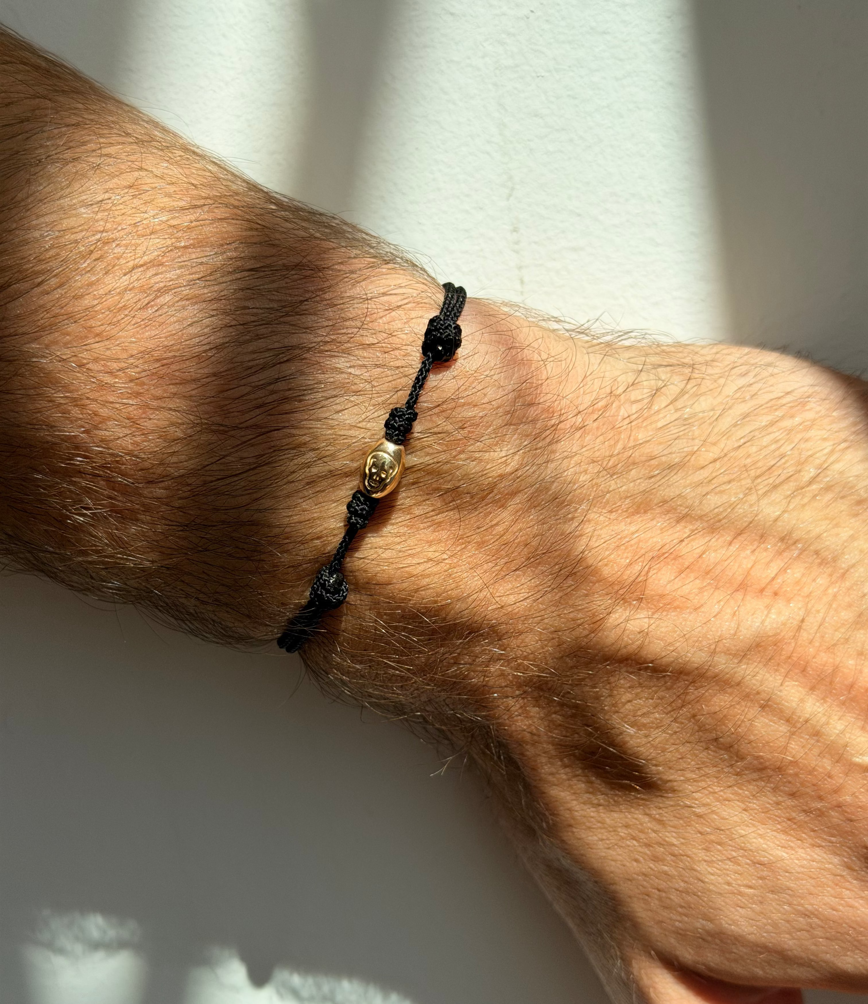Skull Drum Bead on Black Cord Bracelet