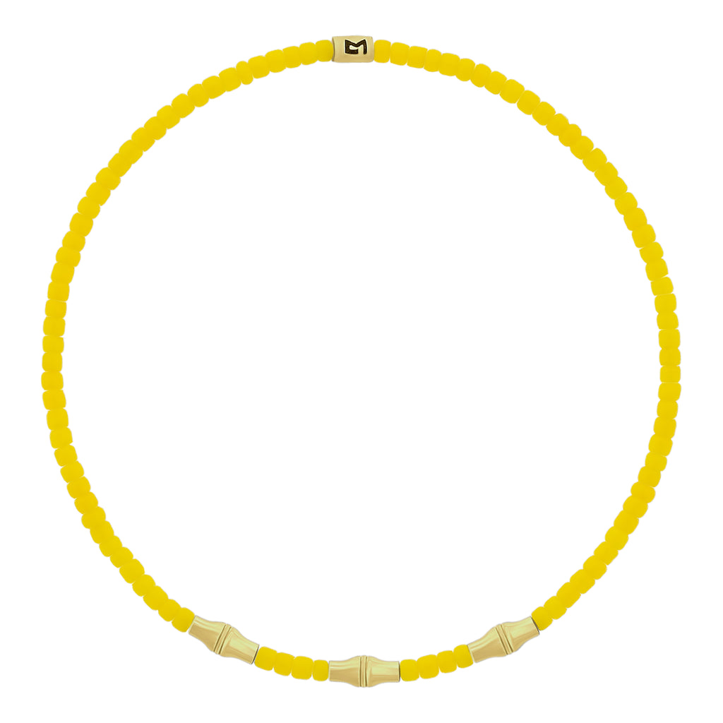 LUIS MORAIS glass beaded bracelet with three 14k yellow gold mini Canister Bamboo tubes and gold logo spacer.&nbsp;Bamboo symbolizes strength, resilience, and the ability to grow through adversity.