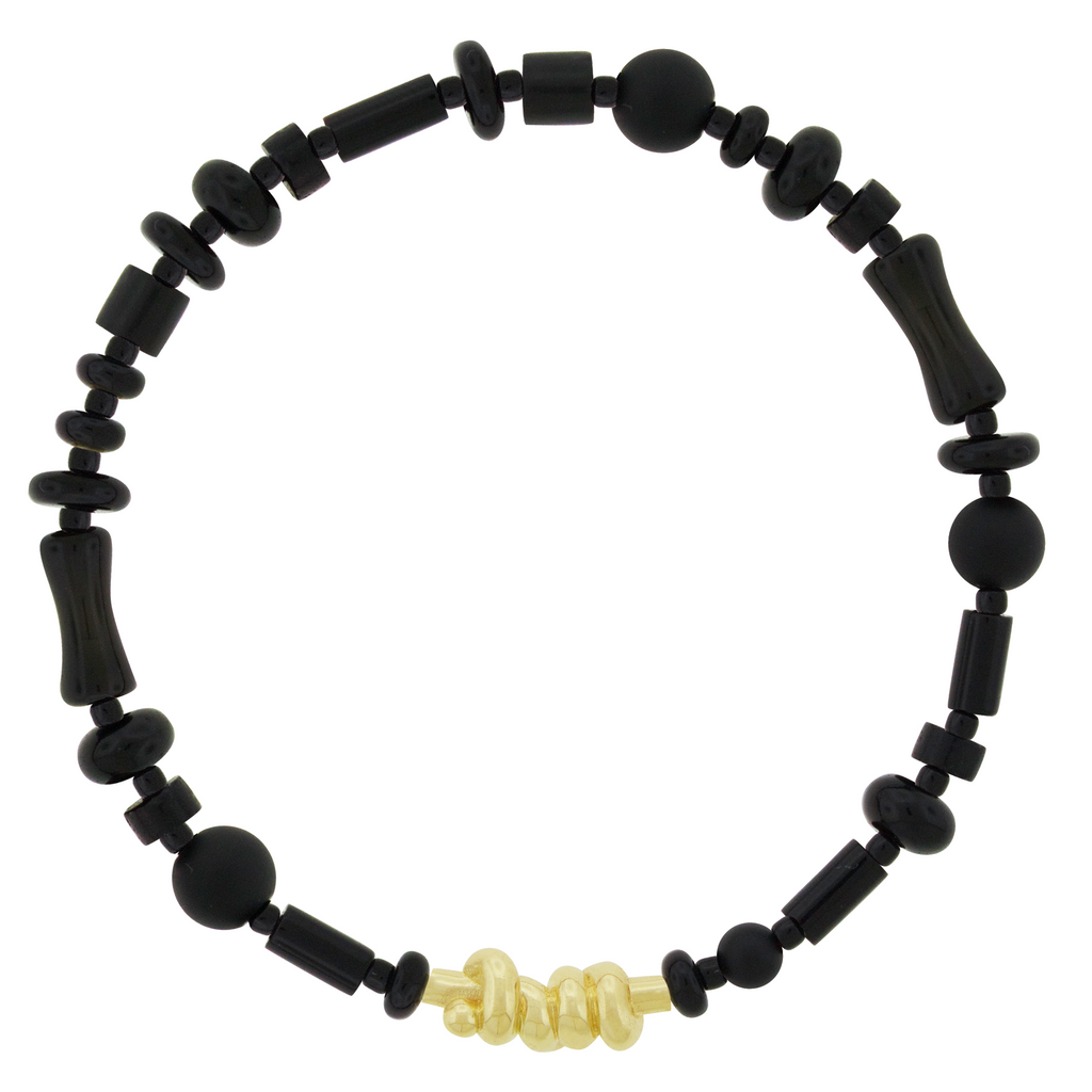 LUIS MORAIS 14k yellow gold Entangled Knot on a gemstone and glass beaded bracelet. This bracelet features an entangled knot, symbolizing the interconnectedness of life, love, and destiny. The design represents how our paths, though complex, are ultimately bound together in a shared journey. A meaningful reminder of the strength found in togetherness the bonds that hold us together.
