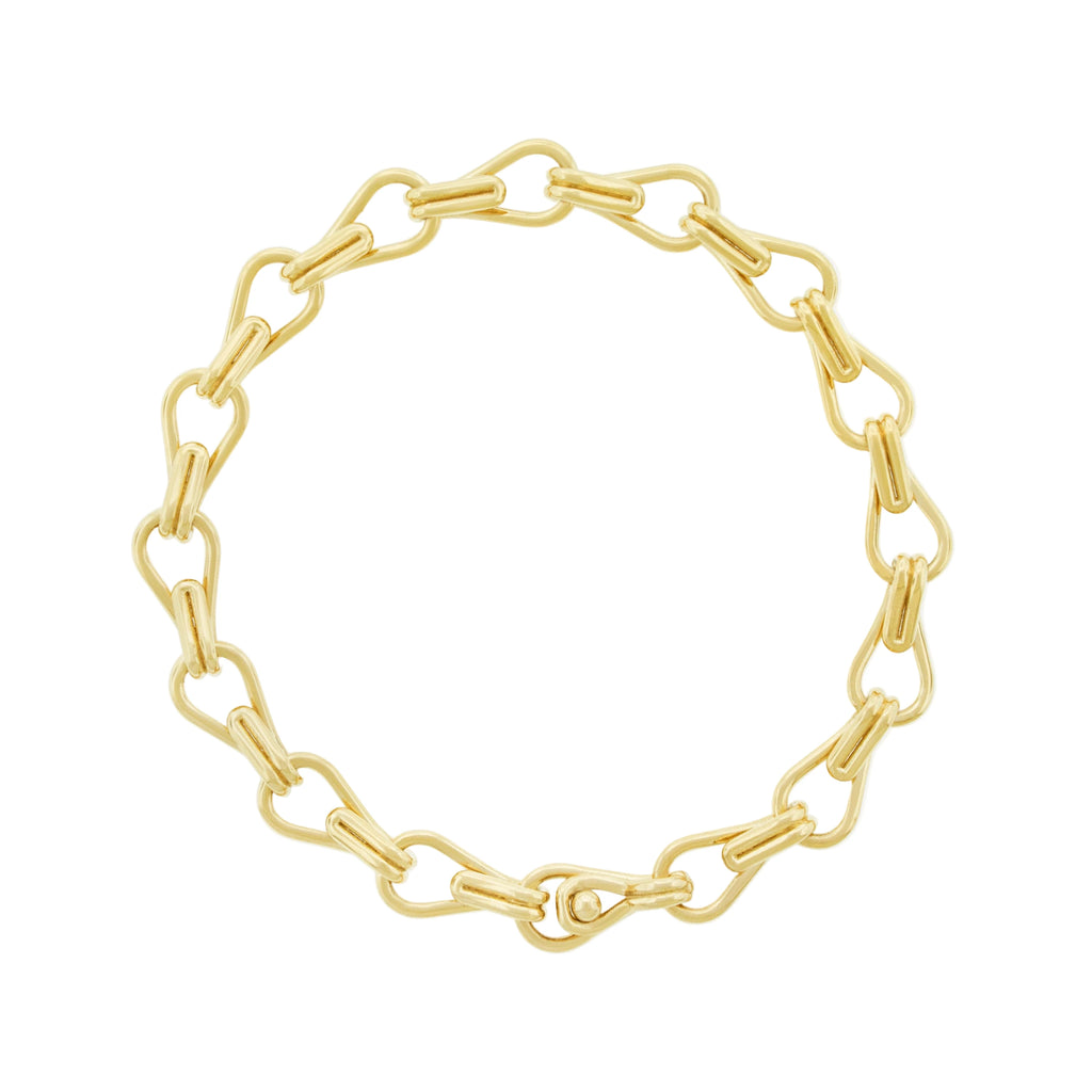 Gold chain bracelet on a white background
