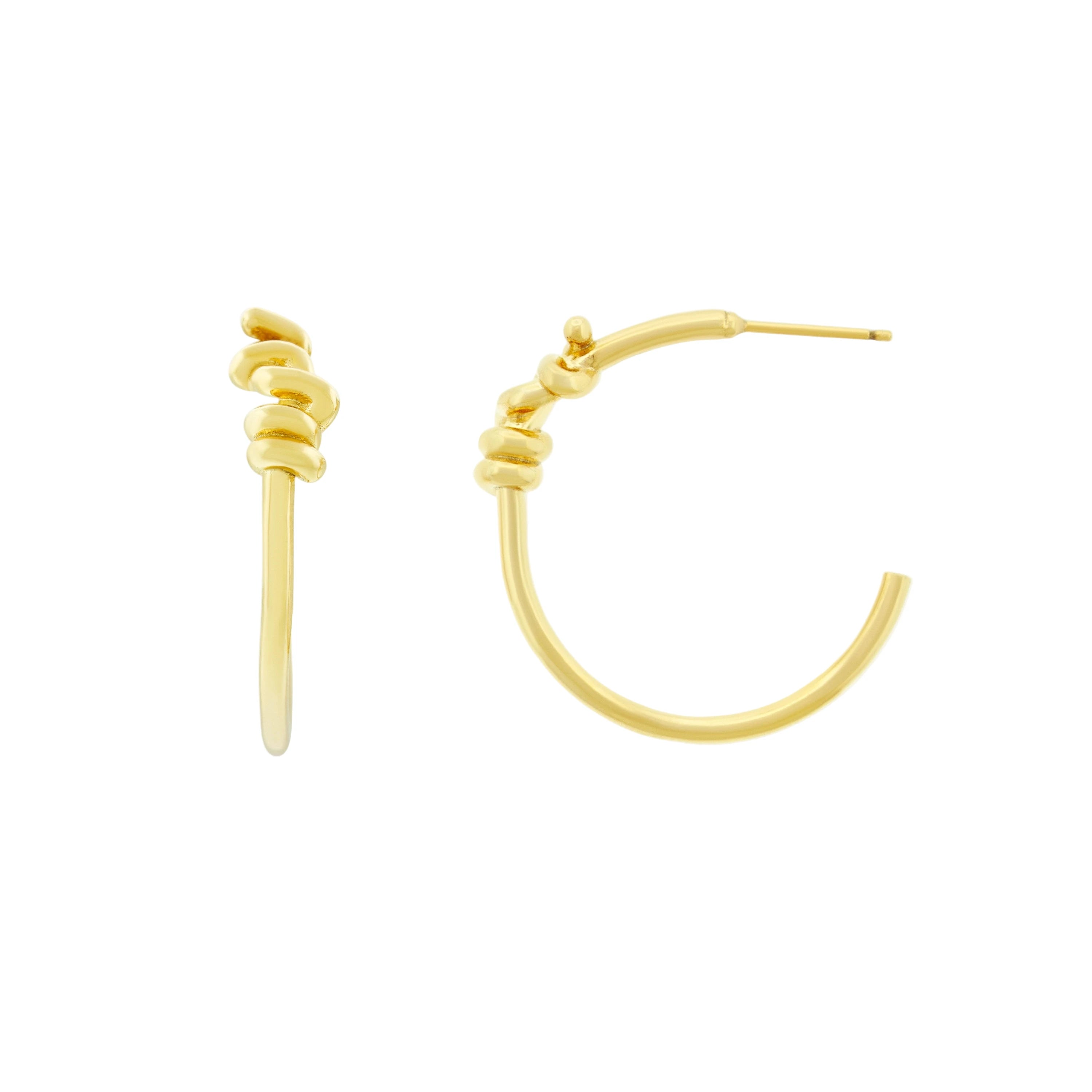Gold hoop earrings on a white background