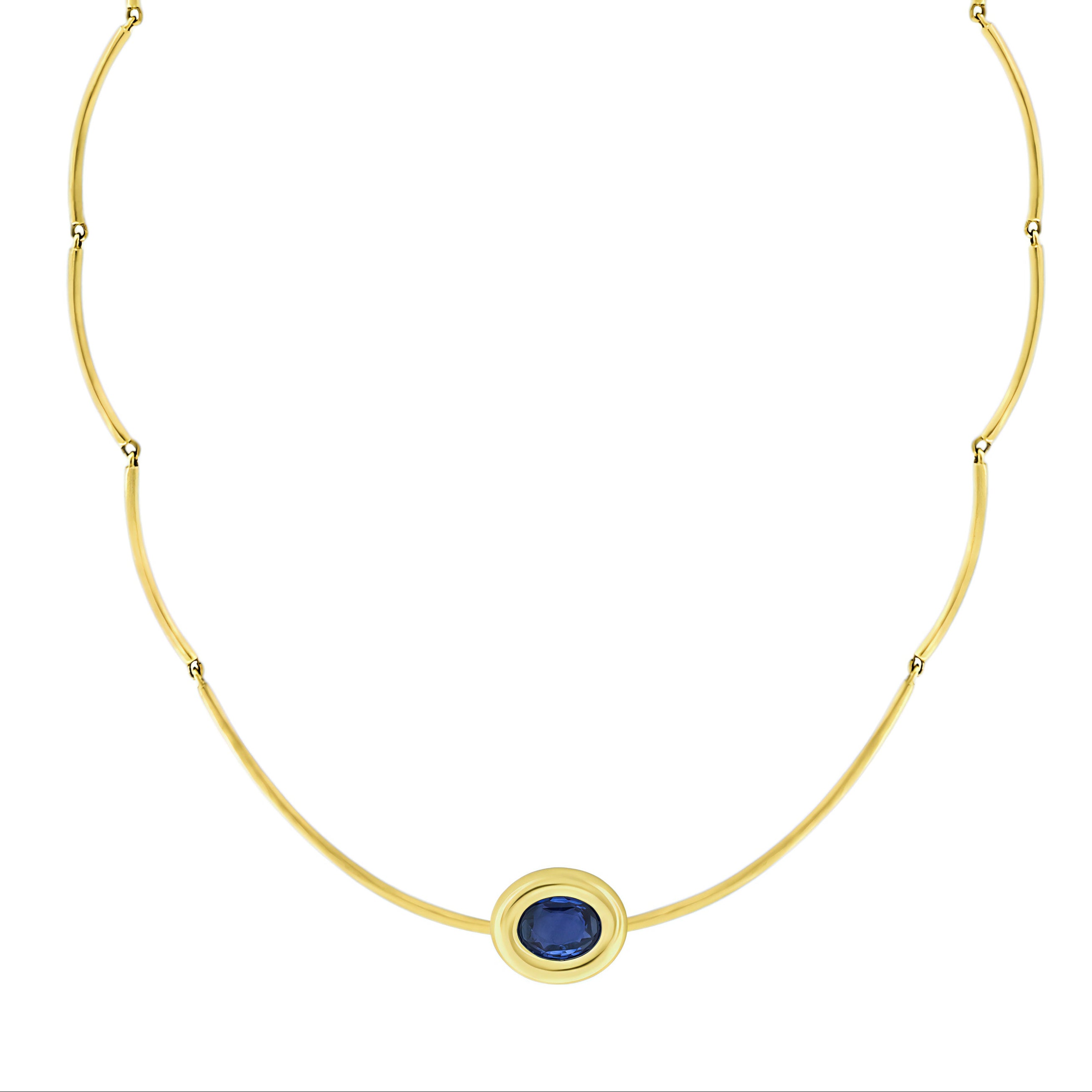 Crafted in 14k yellow gold, this elegant Cloud Link Necklace is accented with a bezeled blue sapphire and finished with a secure clamshell clasp closure.
