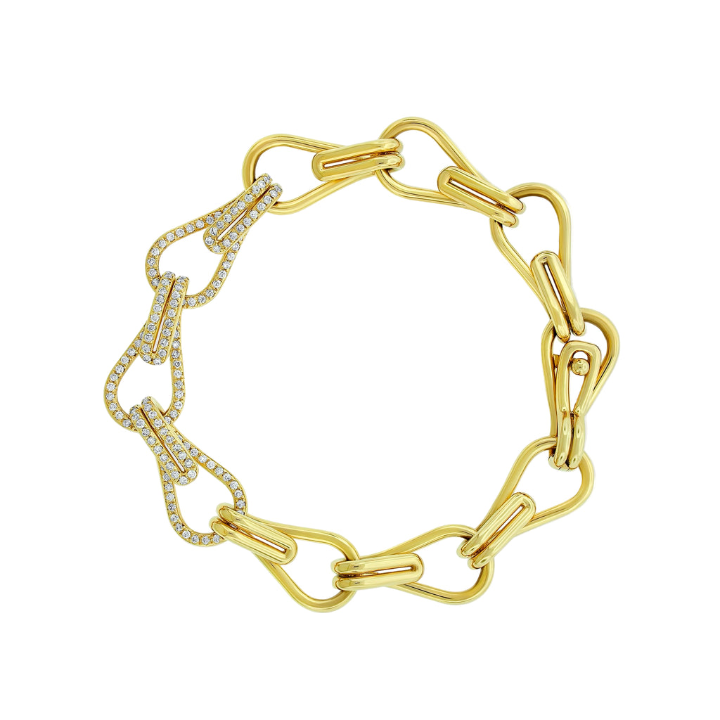 Gold chain bracelet with diamond accents on a white background