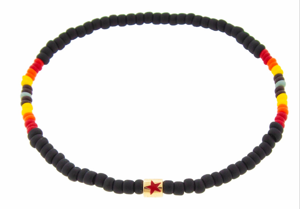 LUIS MORAIS 14K yellow gold short roll with red enameled 5-pointed star symbol on a beaded